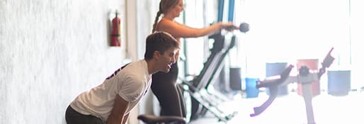 Group Fitness Classes 4 people training with weights together